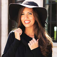 black felt floppy hat with black cowl neck sweater tunic