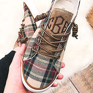 close up of plaid canvas sneakers with twirled laces