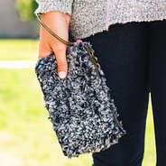 charcoal sherpa wristlet with bangle ring on wrist