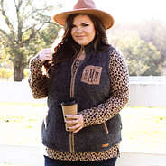 monogrammed sherpa vest with leopard layering tee and wide brim hat