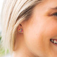 confetti cube earrings in ear