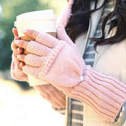 close up of blush fingerless mittens