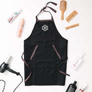 black and leopard personalized apron with flatlay hairdresser