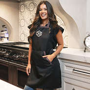 girl wearing black and leopard monogrammed apron