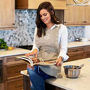 monogrammed apron on brunette