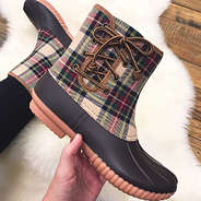 close up shot of camel plaid pull on duck boots