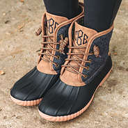 side angle shot of monogrammed heathered charcoal quilted duck boots