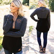 front and back views of monogrammed black fleece pullover with jeans