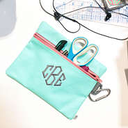 monogrammed mint pouch on desk