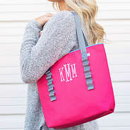 pink monogrammed tote over shoulder