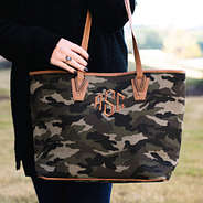 monogrammed camouflage canvas tote on arm