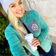 teal monogrammed sherpa jacket selfie
