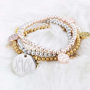 monogrammed mixed metal bracelet set on faux fur