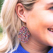 confetti leaf earrings in ear