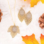 gold fall earrings with matching gold monogrammed necklace