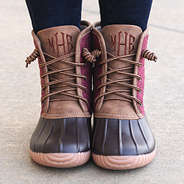 close up of monogrammed burgundy duck boots