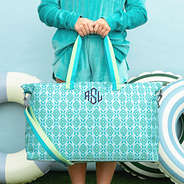 arbua mosaic weekend bag in hand with navy monogram