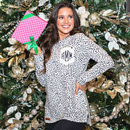white leopard monogrammed sweatshirt in front of christmas tree