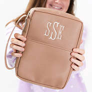 tan bible carrier in hands