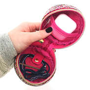 confetti small travel case with hair ties and airpods inside