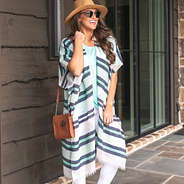 blue and white striped kimono on brunette with hat and crossbody