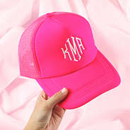 hot pink trucker hat on pink sheet