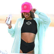 model wearing hot pink trucker hat