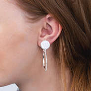 silver monogrammed beaded hoop earrings in ear