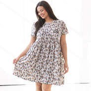 close up of girl wearing stone leopard t shirt dress