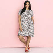 girl wearing stone leopard monogrammed t shirt dress with sandals