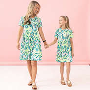 mom and girl wearing bermuda ikat t shirt dresses