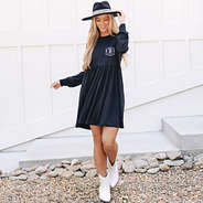 girl wearing monogrammed long sleeve black t shirt dress