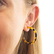 tortoise hoop earrings in ear