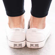 marleylilly branding on the back of monogrammed white canvas sneakers