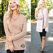 tan monogrammed criss cross tunic with cozy knit vest
