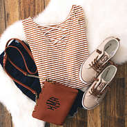 tan monogrammed criss cross tunic with monogrammed sneakers and monogrammed scalloped crossbody