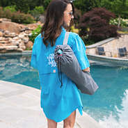 girl carrying beach chair in bag on shoulder