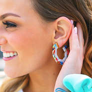 two color resin hoops in ear