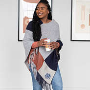 gray colorblock poncho paired with jeans