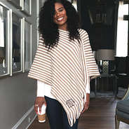 monogrammed striped fringe poncho with white tunic underneath