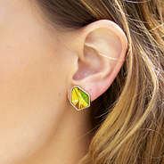 girl wearing diamond shape stud earrings
