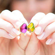 diamond shape stud earrings in hand