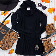 black cowl neck flat lay with leopard accessories