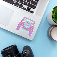 jeep sticker on laptop with camera and plant