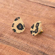 textured leopard print stud earrings on wood