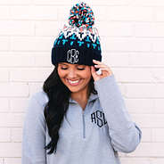 Close up of navy pom pom beanie