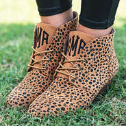 monogrammed leopard dot booties side angle in grass