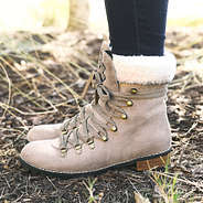 side view of monogrammed lace up boots