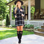 black riding boots with plaid dress and wide brim hat