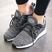 monogrammed camo sneakers with laces tied